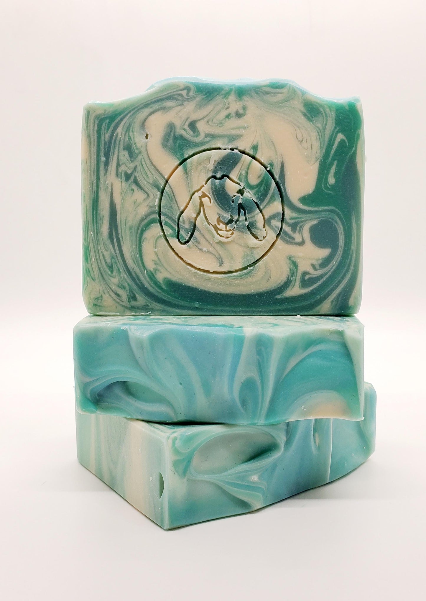 A Handmade goat milk soap bar Scented with Eucalyptus and Cotton fragrance. Fresh Scent, blue with white swirls