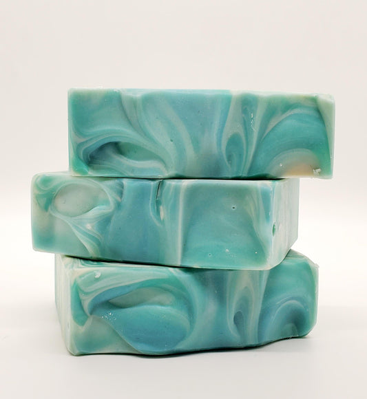 A Handmade goat milk soap bar Scented with Eucalyptus and Cotton fragrance. Fresh Scent, blue with white swirls.