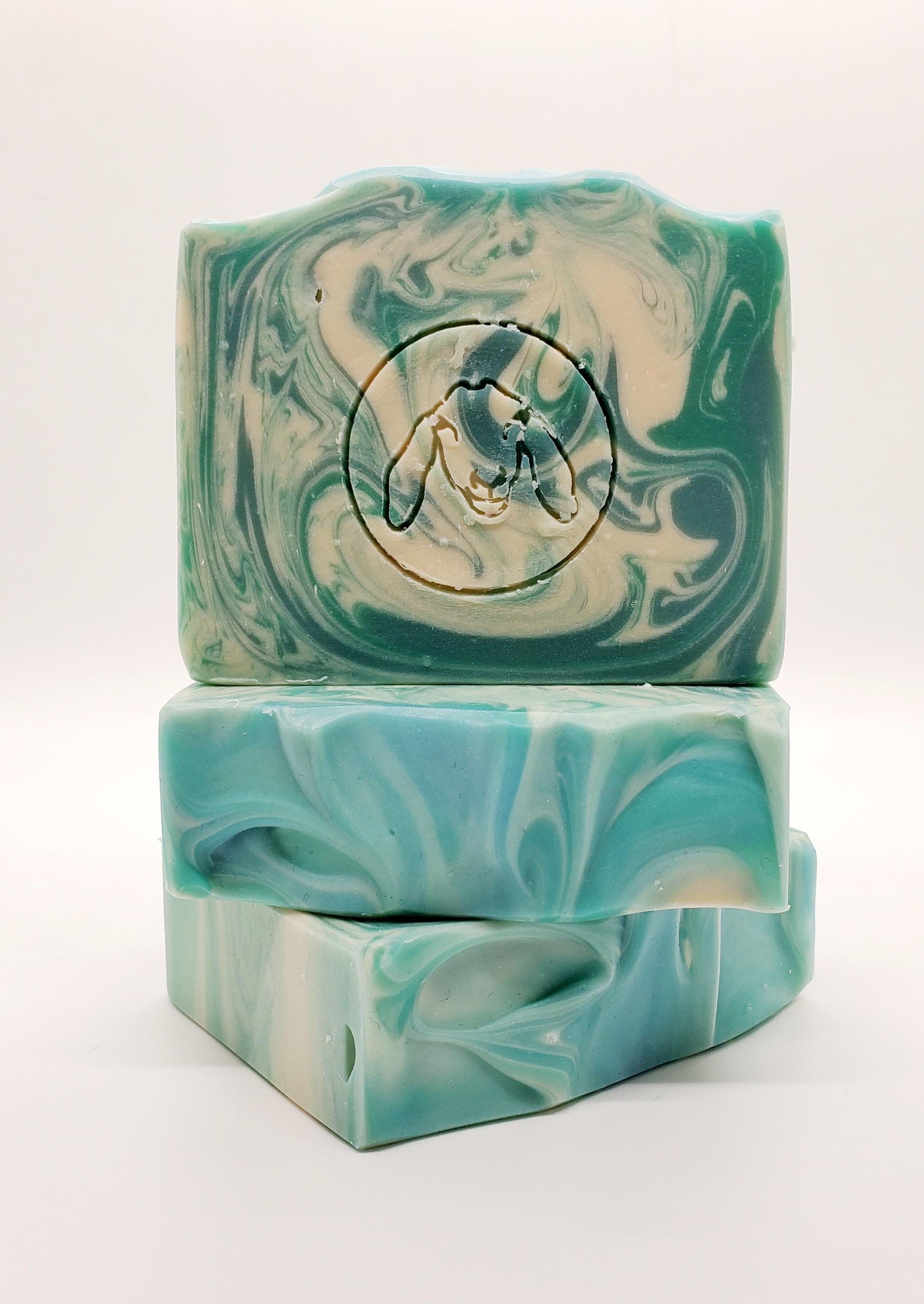 A Handmade goat milk soap bar Scented with Eucalyptus and Cotton fragrance. Fresh Scent, blue with white swirls