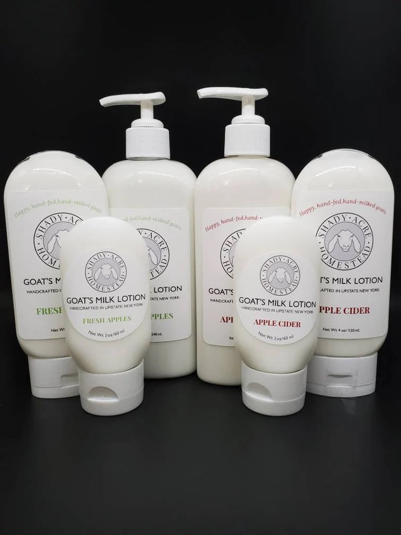 Six bottles of Shady Acres Homestead Goat's Milk Lotion with Fresh Apples and Apple Cider scents.